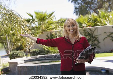 Estate agent showing property, portrait View Large Photo Image Stock Image - Estate agent showing property, portrait. Fotosearch