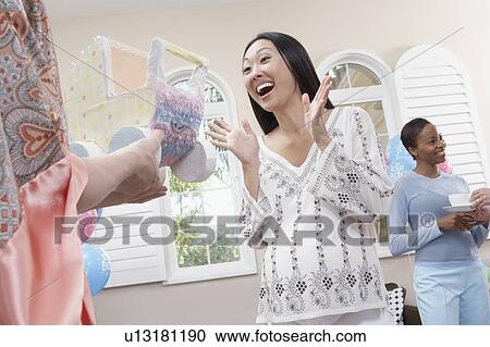 Excited Woman at Her Baby Shower, half length View Large Photo Image Stock Image - Excited Woman at Her Baby Shower, half length. Fotosearch