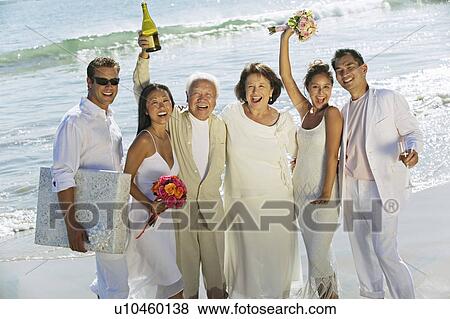 Family celebrating wedding on beach View Large Photo Image Stock Photo - Family celebrating wedding on beach. Fotosearch
