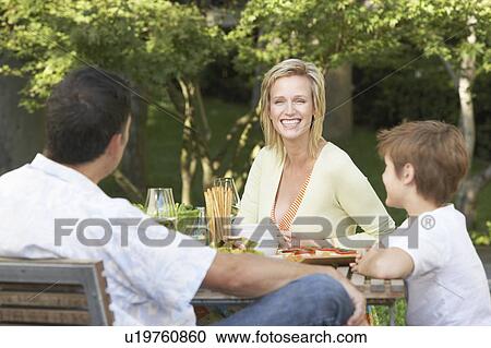 Family having meal outside View Large Photo Image Stock Image - Family having meal outside. Fotosearch