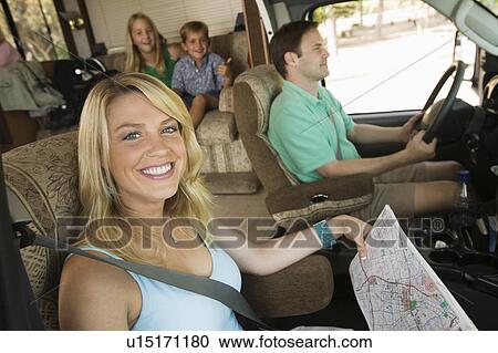 Stock Image - Family in RV on Summer Road Trip. Fotosearch