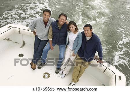 Family on boat, (portrait), (elevated view) View Large Photo Image Stock Photography - Family on boat, (portrait), (elevated view). Fotosearch