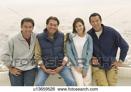Family on boat, (portrait) View Large Photo Image Stock Photograph - Family on boat, (portrait). Fotosearch