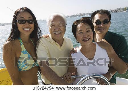 Picture - Family on sailboat, (portrait). Fotosearch