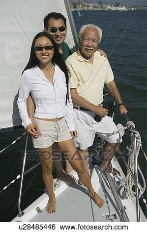 Family on sailboat, (portrait) View Large Photo Image Stock Photograph - Family on sailboat, (portrait). Fotosearch