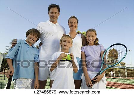 Family on Tennis Court by net, portrait, front view View Large Photo Image Stock Photo - Family on Tennis Court by net, portrait, front view. Fotosearch