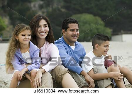 Family relaxing on beach View Large Photo Image Picture - Family relaxing on beach. Fotosearch