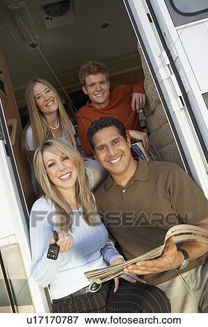 Family sitting in doorway of RV, group portrait View Large Photo Image Stock Photo - Family sitting in doorway of RV, group portrait. Fotosearch