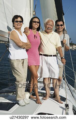 Family smiling on Sailboat, (portrait) View Large Photo Image Stock Photo - Family smiling on Sailboat, (portrait). Fotosearch