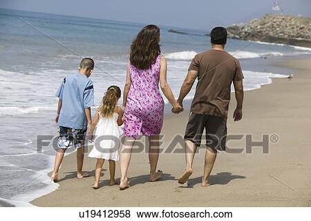 Family Walking Along Beach View Large Photo Image Stock Photo - Family Walking Along Beach. Fotosearch
