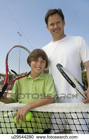 Father and Son at Tennis Net, portrait View Large Photo Image Stock Image - Father and Son at Tennis Net, portrait. Fotosearch