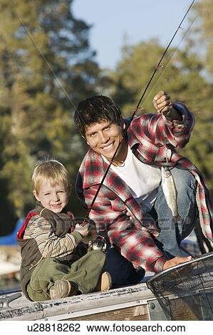 Father and Son fly fishing View Large Photo Image Stock Image - Father and Son fly fishing. Fotosearch