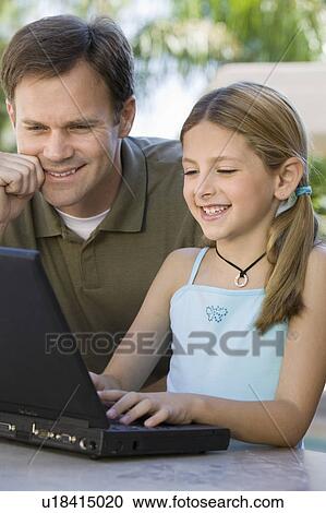 Father Watching Daughter Use Laptop View Large Photo Image Stock Image - Father Watching Daughter Use Laptop. Fotosearch