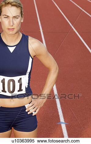 Female athlete on running track, half length View Large Photo Image Stock Photography - Female athlete on running track, half length. Fotosearch