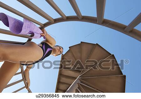 Female diver on spiral staircase to board, view from below View Large Photo Image Stock Photography - Female diver on spiral staircase to board, view from below. Fotosearch