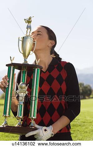 Female golfer kissing trophy View Large Photo Image Stock Image - Female golfer kissing trophy. Fotosearch