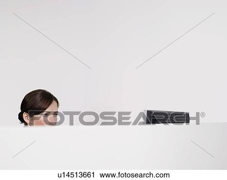 Female office worker in office cubicle View Large Photo Image Stock Image - Female office worker in office cubicle. Fotosearch