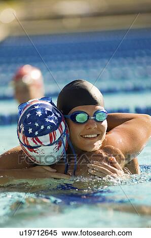 Female swimmer congratulating winner after race in pool View Large Photo Image Stock Photography - Female swimmer congratulating winner after race in pool. Fotosearch