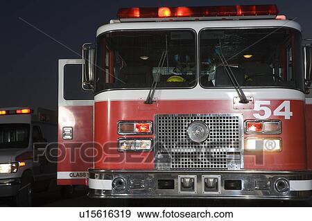Fire engine and ambulance at night View Large Photo Image Stock Photo - Fire engine and ambulance at night. Fotosearch