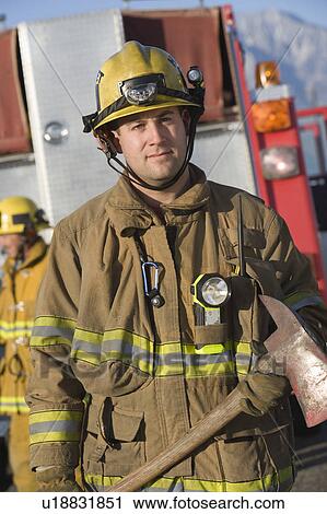 Firefighter with vehicle View Large Photo Image Stock Image - Firefighter with vehicle. Fotosearch