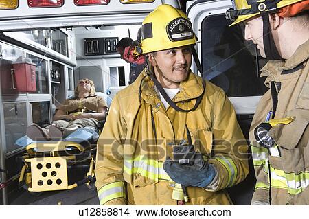 Firefighters and ambulance View Large Photo Image Picture - Firefighters and ambulance. Fotosearch