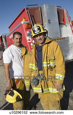 Stock Image - Firefighters and truck. Fotosearch