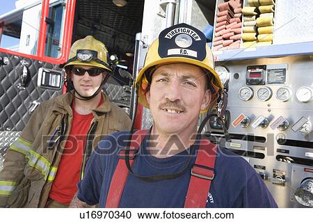 Stock Image - Firefighters and truck. Fotosearch