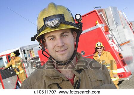 Stock Photo - Firefighters and truck. Fotosearch