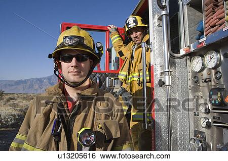 Firefighters and truck View Large Photo Image Stock Photograph - Firefighters and truck. Fotosearch
