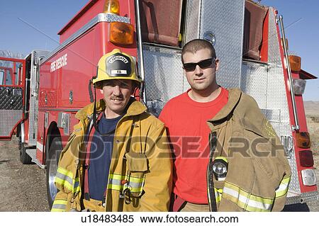 Firefighters in front of truck View Large Photo Image Stock Photography - Firefighters in front of truck. Fotosearch