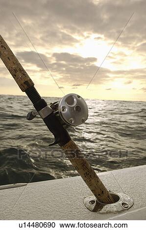 Fishing rod in holder on boat, (close-up) View Large Photo Image Stock Image - Fishing rod in holder on boat, (close-up). Fotosearch