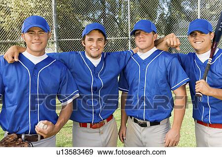 Four baseball team-mates posing on field, (portrait) View Large Photo Image Stock Photo - Four baseball team-mates posing on field, (portrait). Fotosearch