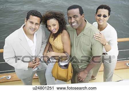 Stock Image - Four Friends on Yacht. Fotosearch