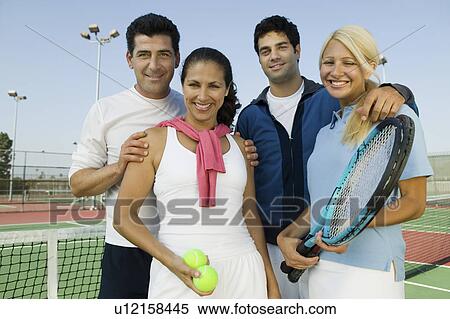 Four mixed doubles tennis players by net at tennis court, portrait View Large Photo Image Stock Photography - Four mixed doubles tennis players by net at tennis court, portrait. Fotosearch