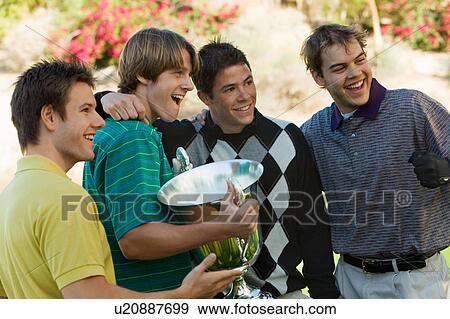 Four young golfers posing with trophy View Large Photo Image Stock Photo - Four young golfers posing with trophy. Fotosearch