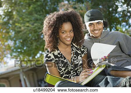Picture - Friends studying outdoors, (portrait). Fotosearch