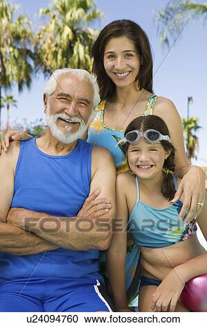Girl (10-12) with mother and grandfather, front view portrait. View Large Photo Image Stock Image - Girl (10-12) with mother and grandfather, front view portrait.. Fotosearch