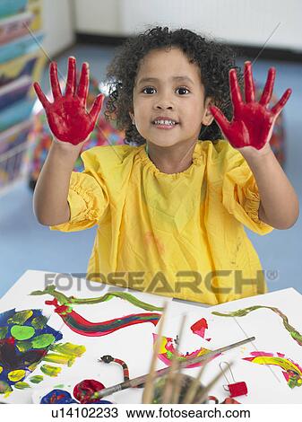Girl finger painting in art class, elevated view View Large Photo Image Stock Image - Girl finger painting in art class, elevated view. Fotosearch