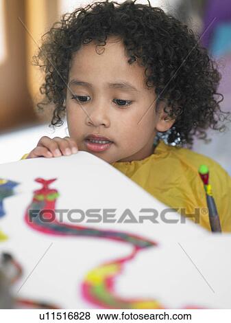 Stock Photo - Girl looking at painting in art class. Fotosearch