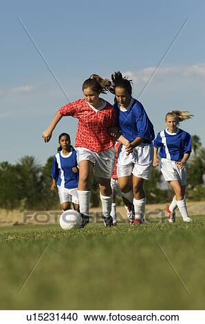 Girls (13-17) playing soccer View Large Photo Image Stock Image - Girls (13-17) playing soccer. Fotosearch
