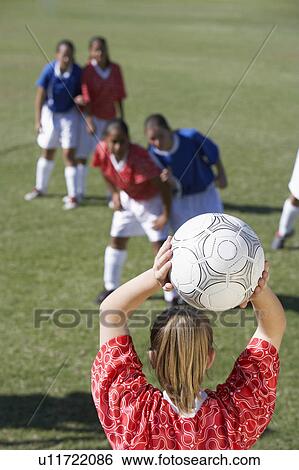 Stock Photograph - Girls Playing Soccer. Fotosearch
