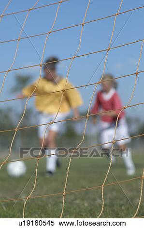 Stock Photography - Girls Playing Soccer. Fotosearch
