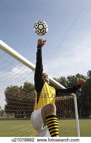 Goalkeeper reaching for ball View Large Photo Image Stock Image - Goalkeeper reaching for ball. Fotosearch