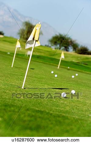 Golf course green with flags and balls View Large Photo Image Stock Image - Golf course green with flags and balls. Fotosearch