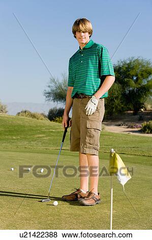 Golfer practising putting View Large Photo Image Stock Photo - Golfer practising putting. Fotosearch