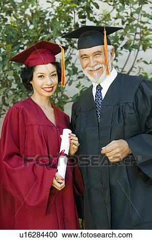 Graduate and dean outside, portrait View Large Photo Image Stock Image - Graduate and dean outside, portrait. Fotosearch