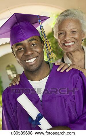 Graduate and grandmother outside, portrait View Large Photo Image Stock Photo - Graduate and grandmother outside, portrait. Fotosearch