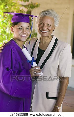 Graduate and grandmother outside, portrait View Large Photo Image Stock Photograph - Graduate and grandmother outside, portrait. Fotosearch