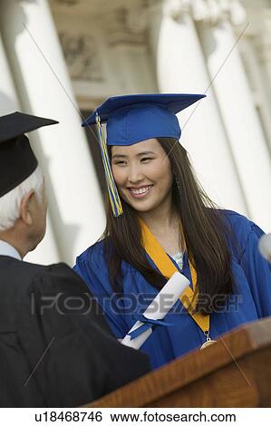 Graduate Receiving Diploma outside university View Large Photo Image Stock Photograph - Graduate Receiving Diploma outside university. Fotosearch