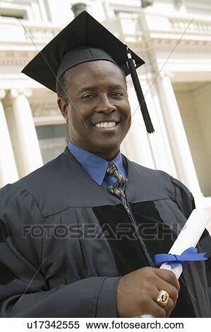 Graduate with Diploma outside university, portrait View Large Photo Image Stock Photography - Graduate with Diploma outside university, portrait. Fotosearch